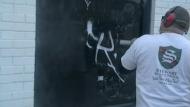 Graffiti being removed from window